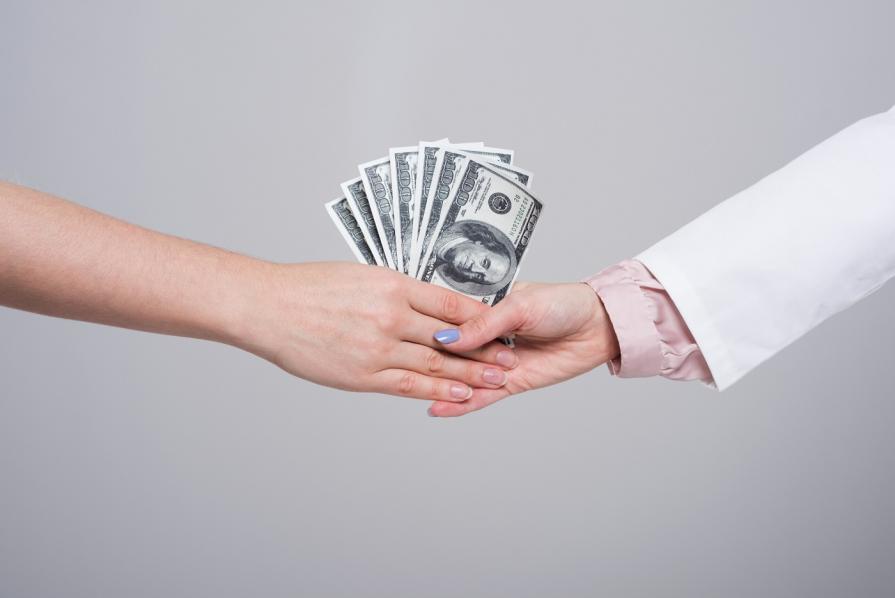 Bribes in prestigious universities in the USA and Russia